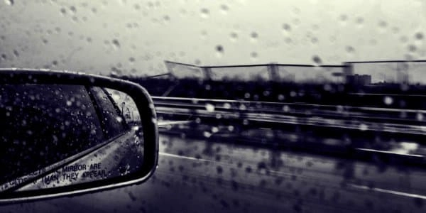 rain safety warning on car wing mirror