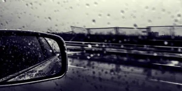 rain safety warning on car wing mirror